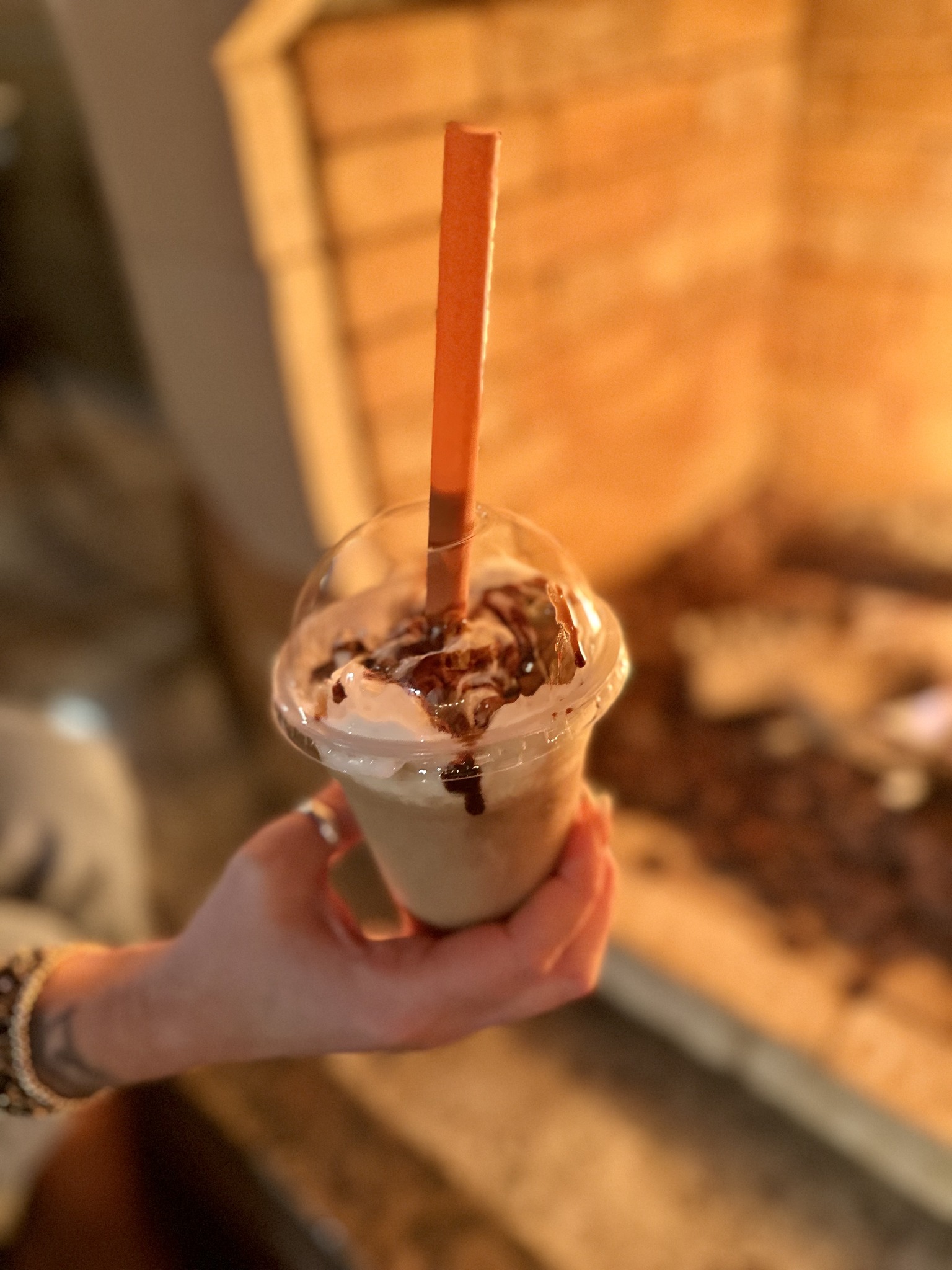 Frozen margarita-style drink with the patio fireplace glowing in the background